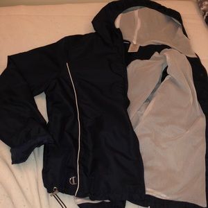 Navy blue wind breaker with mesh lining.
